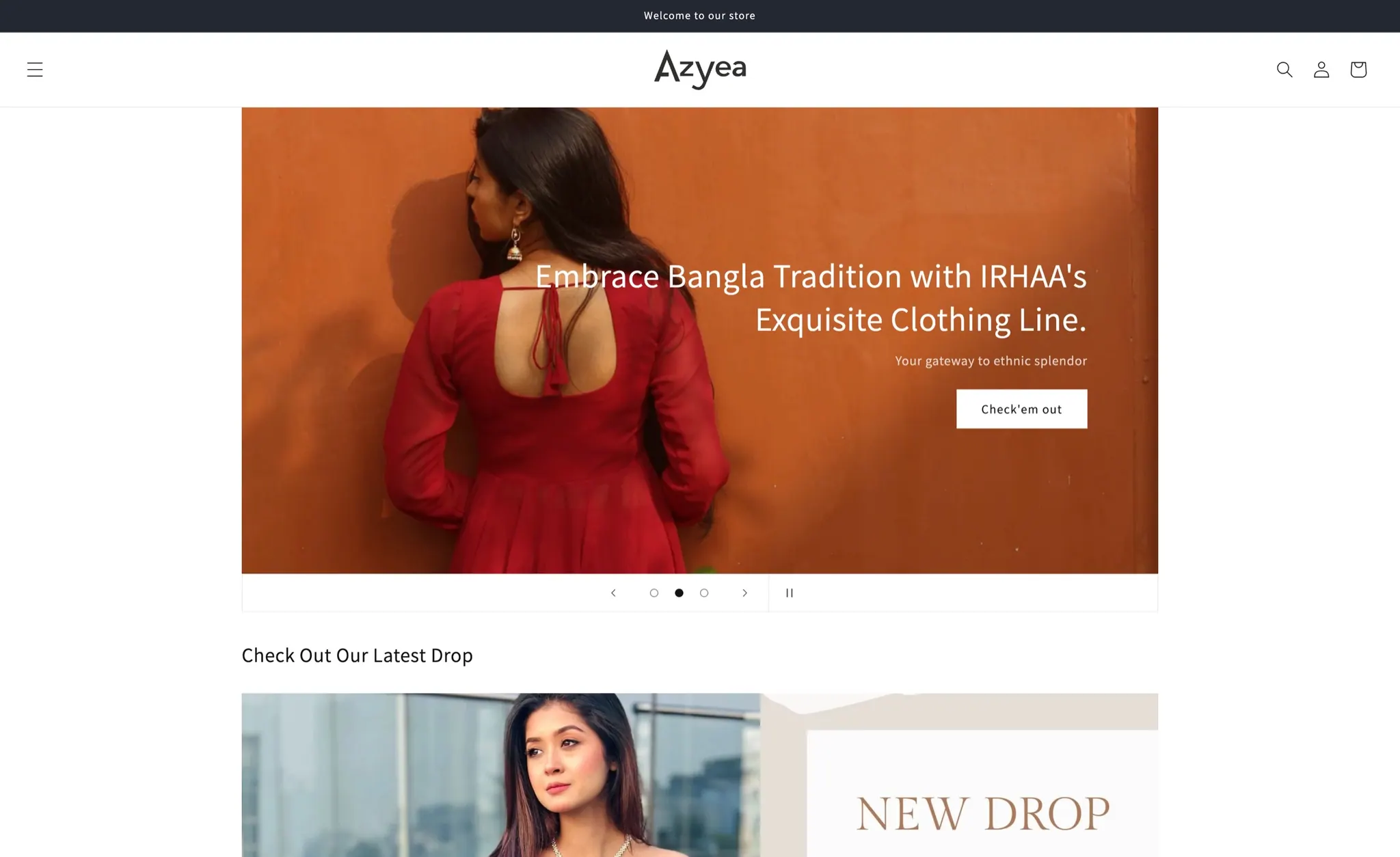 The Azyea storefront: the brand's wordmark above a hero photograph of a model in a red dress against a terracotta wall, with the latest collection beginning below it.